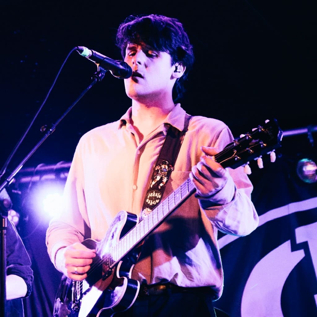 Shaun performing live with guitar